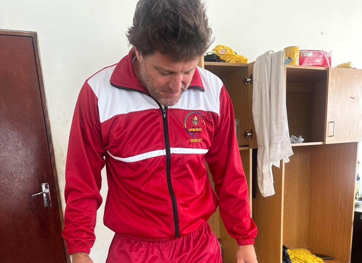 Man wearing a red Amahlathi track jacket